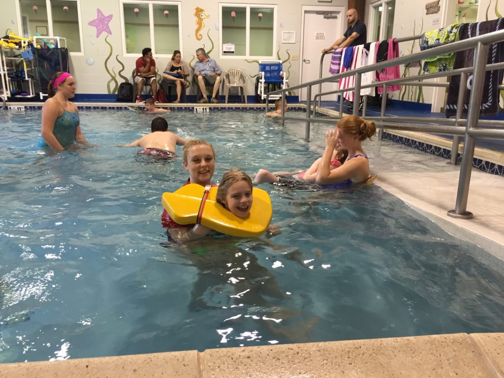 Image shows aquatic patients and their therapists practicing in the Schreiber indoor pool