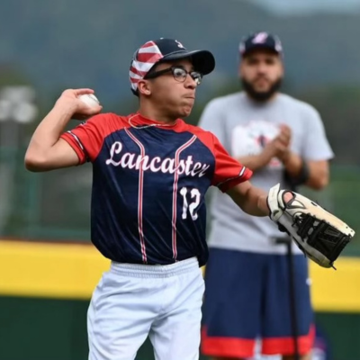 Javion throwing a baseball during a game.