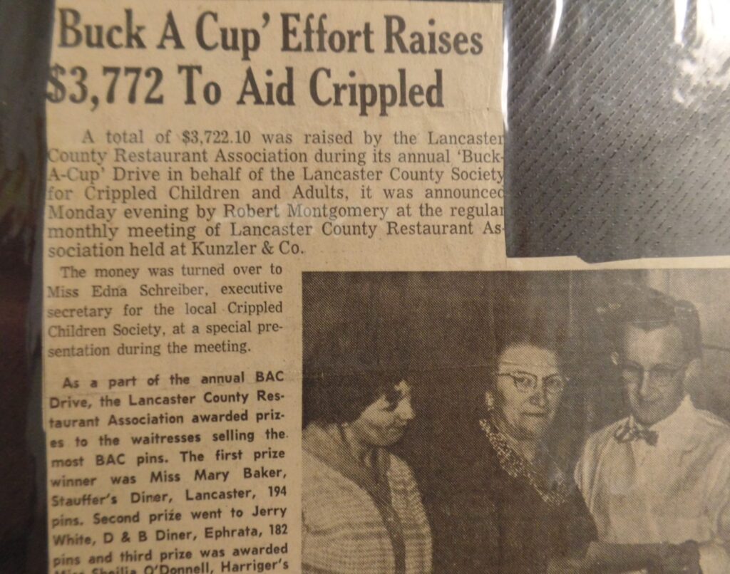 Newspaper clipping with title "Buck a Cup Effort Raises $3,772 to Aid Crippled"