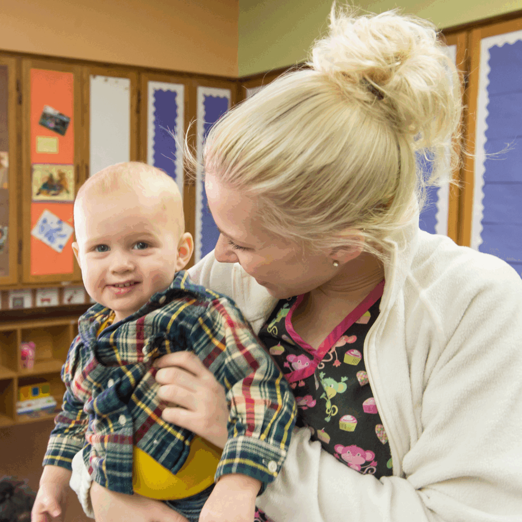 young woman holding baby boy