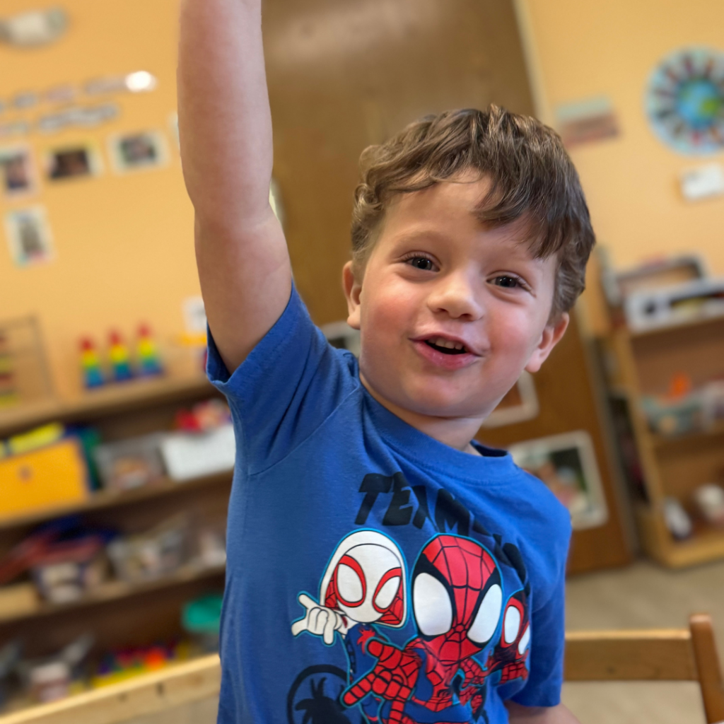 little boy in blue shirt playing in daycare