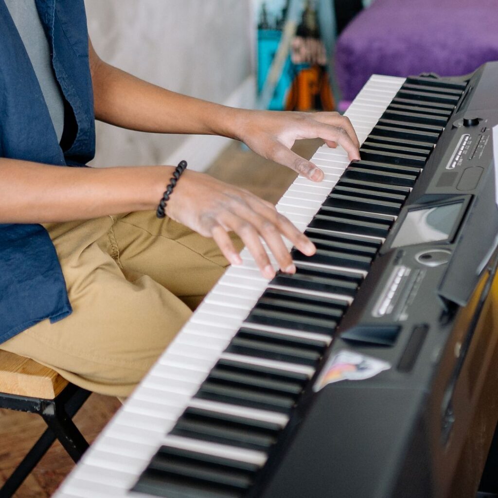 Hands on piano keyboard